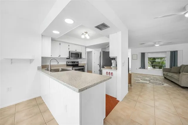 a kitchen with a sink and cabinets