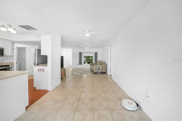 a view of kitchen with furniture and natural light
