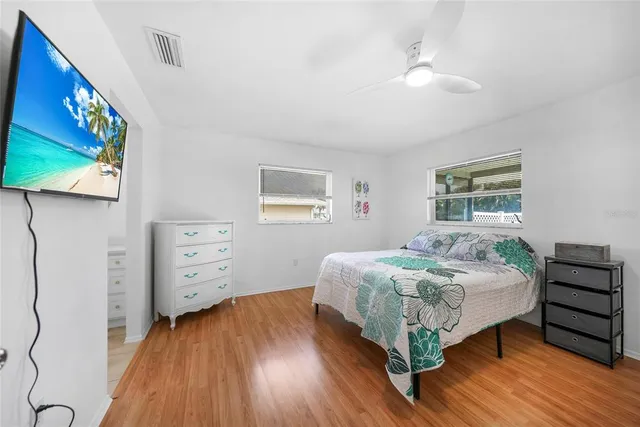 a bedroom with a bed and a dresser