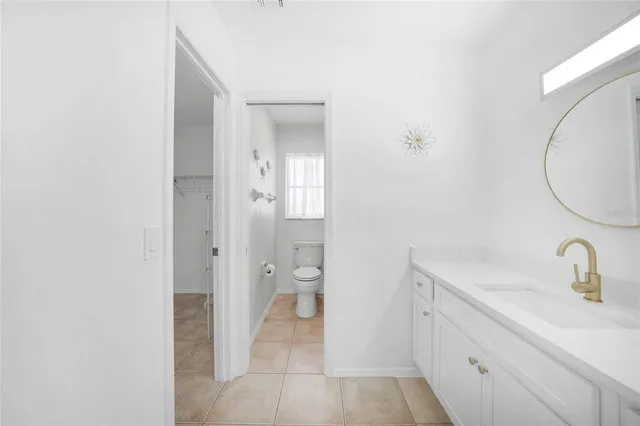 a bathroom with a toilet sink and shower