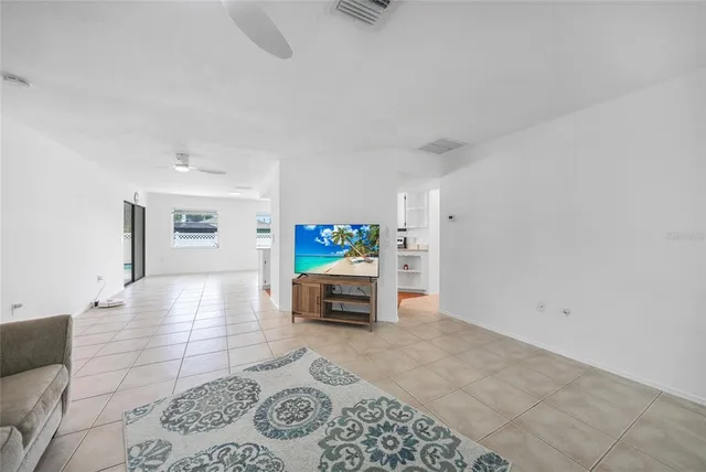 a view of kitchen with stainless steel appliances granite countertop refrigerator sink and cabinets