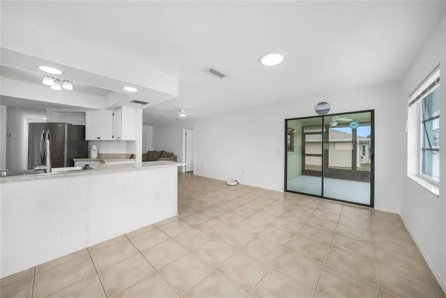 a kitchen with a stove a sink and a microwave