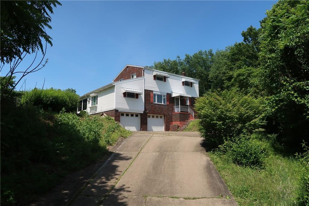 12859 Pine Hollow Road Trafford, PA 15085 - Photo 24 of 25 Covered Front Porch, Window Awnings, Concrete Driveway, Plenty of Parking!