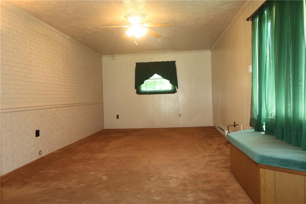12859 Pine Hollow Road Trafford, PA 15085 - Photo 6 of 25 Large Window, Seat, Brick Wall (no Hardwood under Plush carpeting this room)