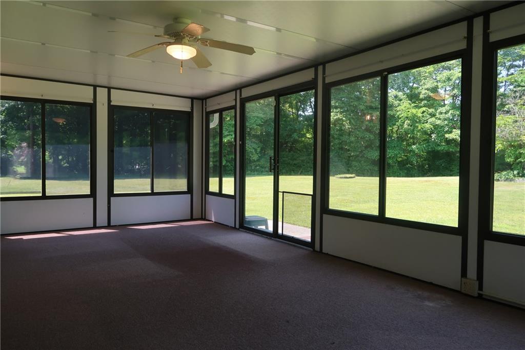 12859 Pine Hollow Road Trafford, PA 15085 - Photo 9 of 25 24'x12' Glorious Sunroom / 3 Window Air Conditioning Units with Home