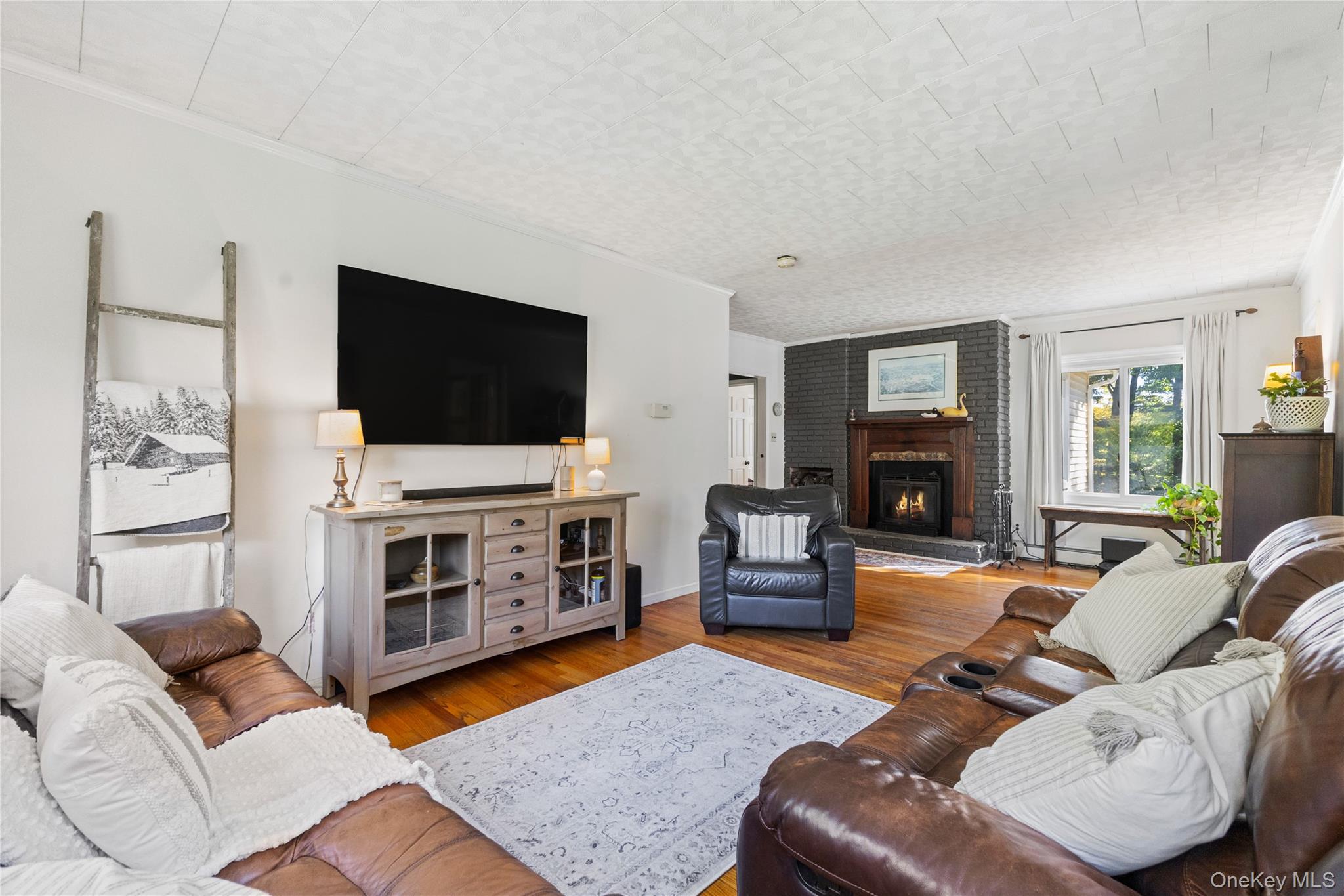 1645 Amazon Road, Unit 1645 Mohegan Lake, NY 10547 - Photo 11 of 50 a living room with furniture and a flat screen tv