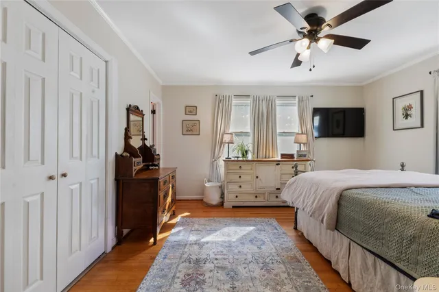 a bed room with a bed and a tv