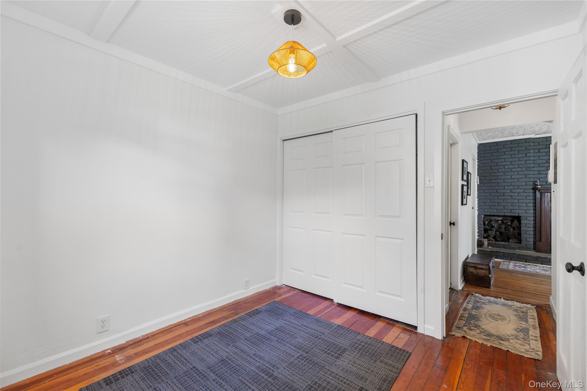 1645 Amazon Road, Unit 1645 Mohegan Lake, NY 10547 - Photo 21 of 50 a view of an empty room with wooden floor and a window