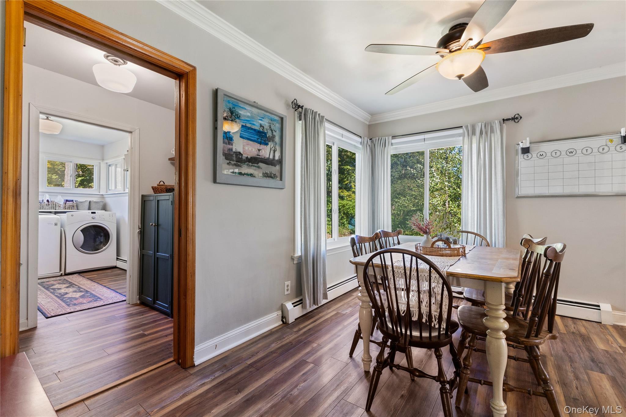 1645 Amazon Road, Unit 1645 Mohegan Lake, NY 10547 - Photo 23 of 50 a view of a dining room with furniture window and wooden floor
