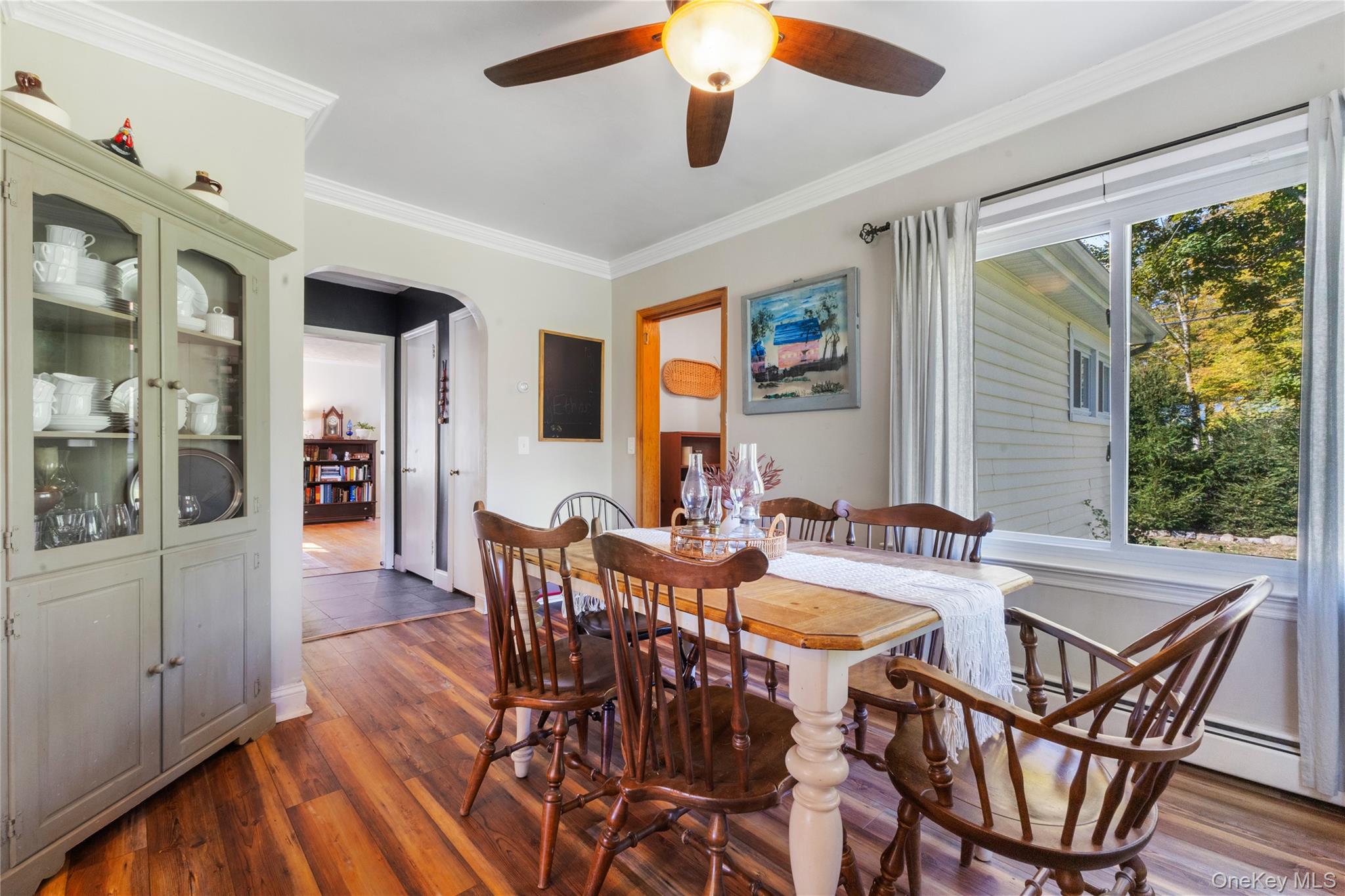 1645 Amazon Road, Unit 1645 Mohegan Lake, NY 10547 - Photo 26 of 50 a view of a dining room with furniture window and wooden floor