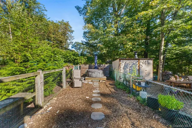 a view of backyard with outdoor seating and trees