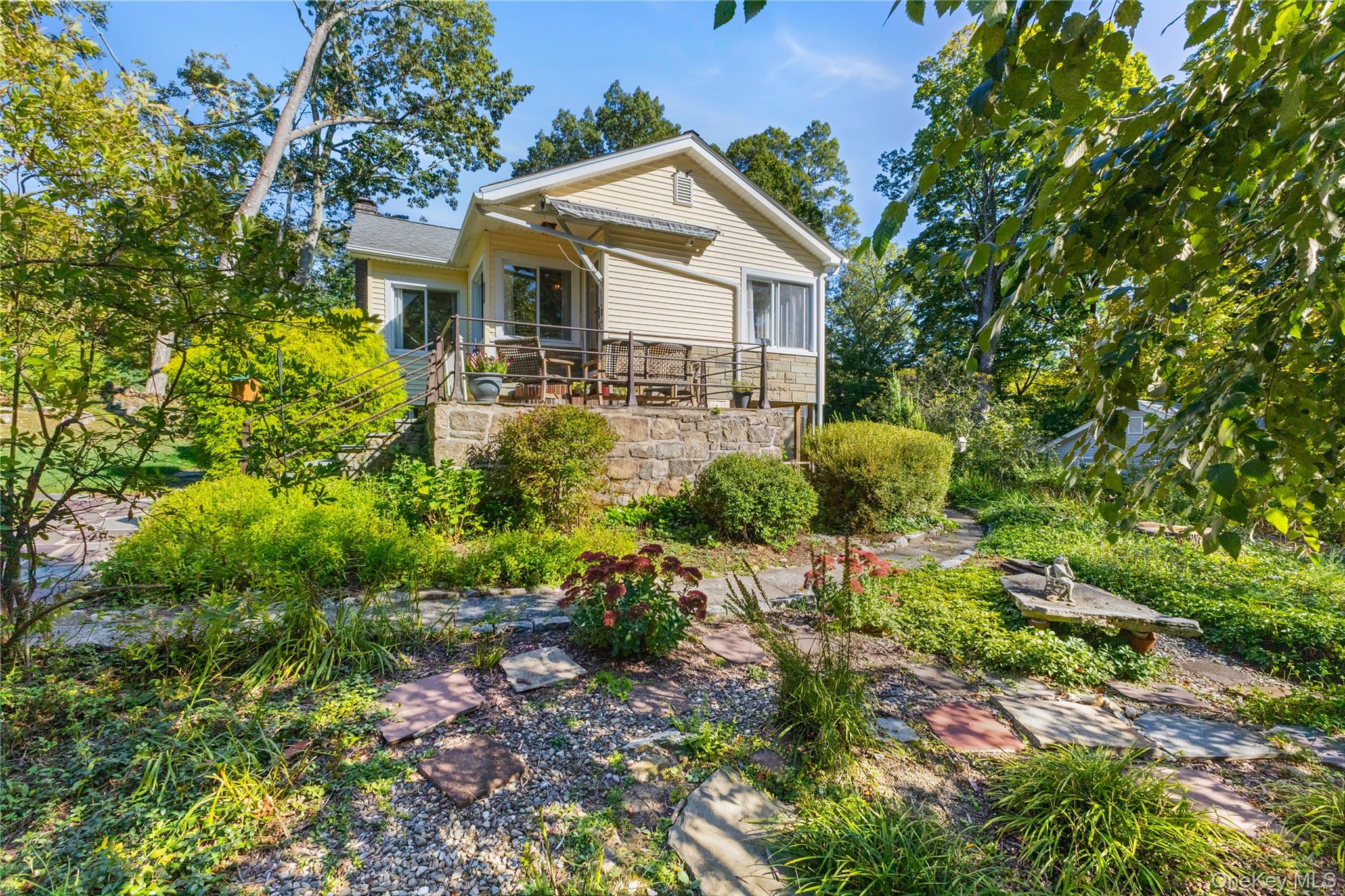 1645 Amazon Road, Unit 1645 Mohegan Lake, NY 10547 - Photo 36 of 50 a front view of a house with a yard and garden