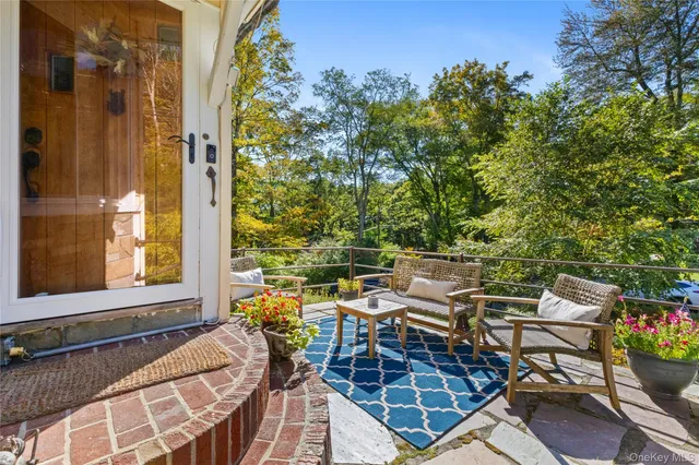 a view of a patio with a table and chairs in patio
