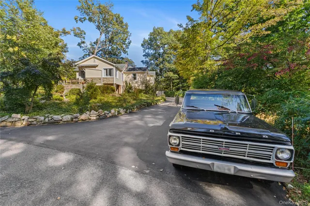 a view of a swimming pool with a chair and tables