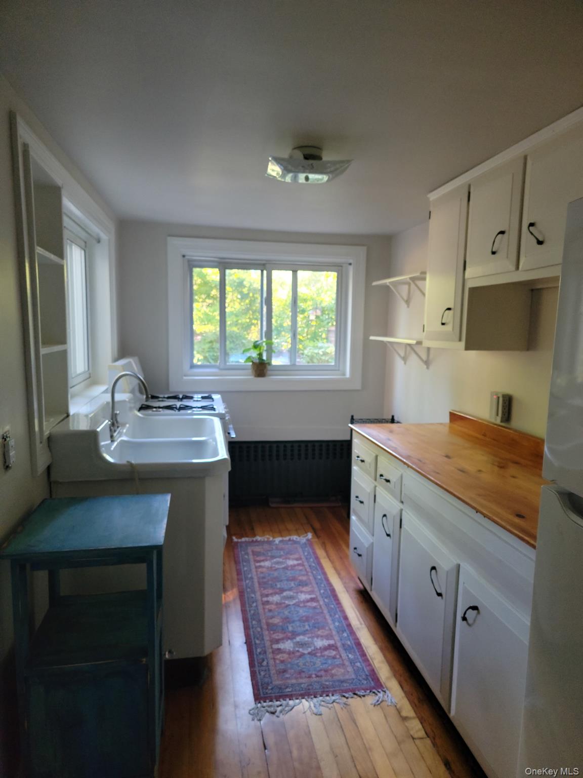 1645 Amazon Road, Unit 1645 Mohegan Lake, NY 10547 - Photo 44 of 50 a kitchen with kitchen island granite countertop a sink stove and cabinets