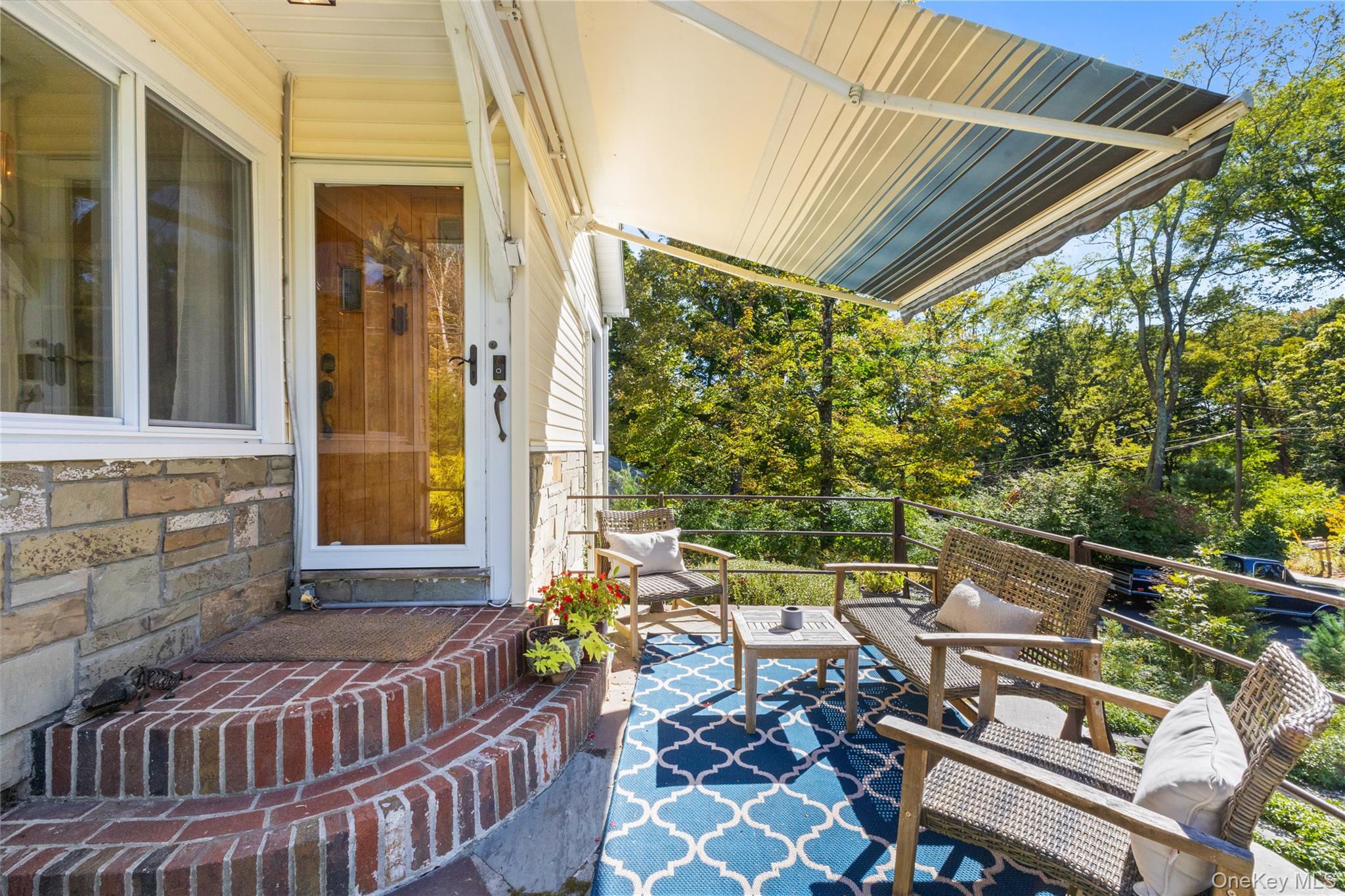 1645 Amazon Road, Unit 1645 Mohegan Lake, NY 10547 - Photo 5 of 50 a balcony with wooden floor and outdoor seating