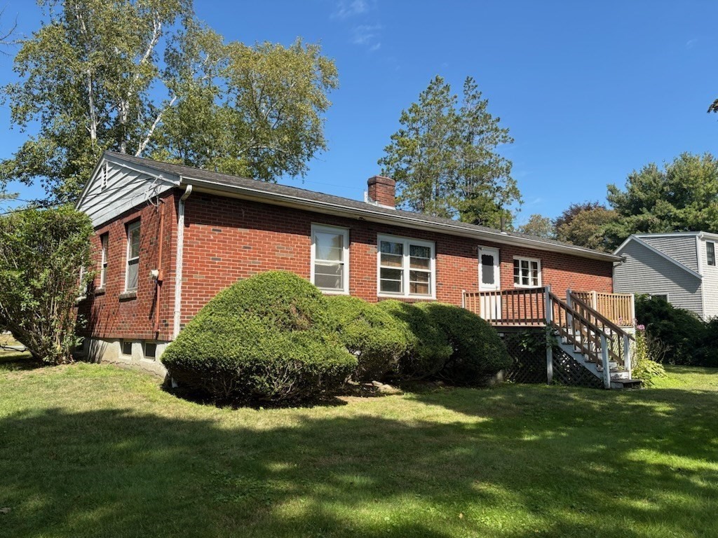 6 Higgins Road Marblehead, MA 01945 - Photo 1 of 9 a front view of a house with a yard