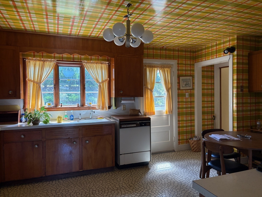 6 Higgins Road Marblehead, MA 01945 - Photo 5 of 9 a kitchen with a stove and a wooden cabinets