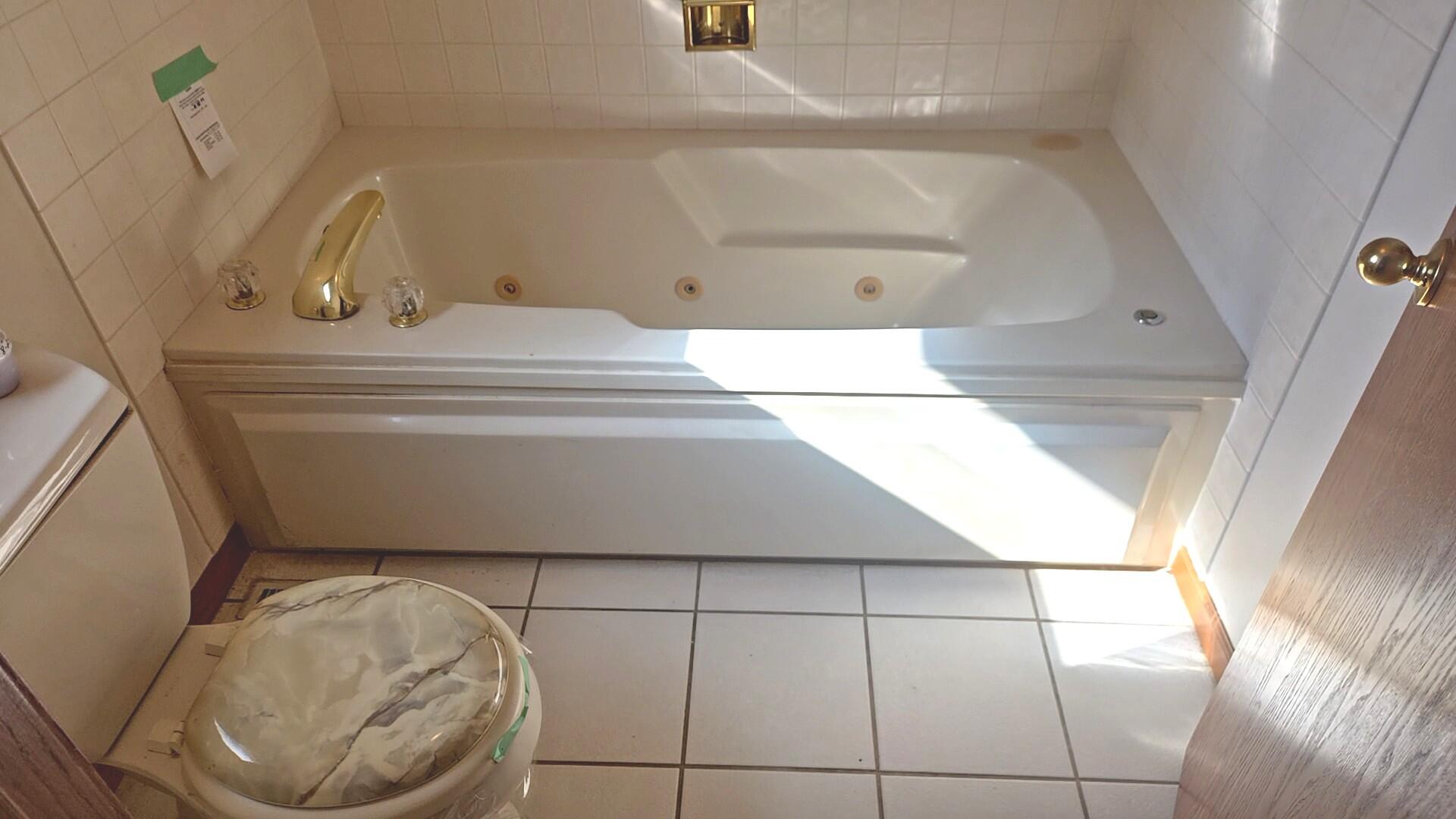 1951 West Ash Street Griffith, IN 46319 - Photo 18 of 23 a bathroom with a sink and a mirror
