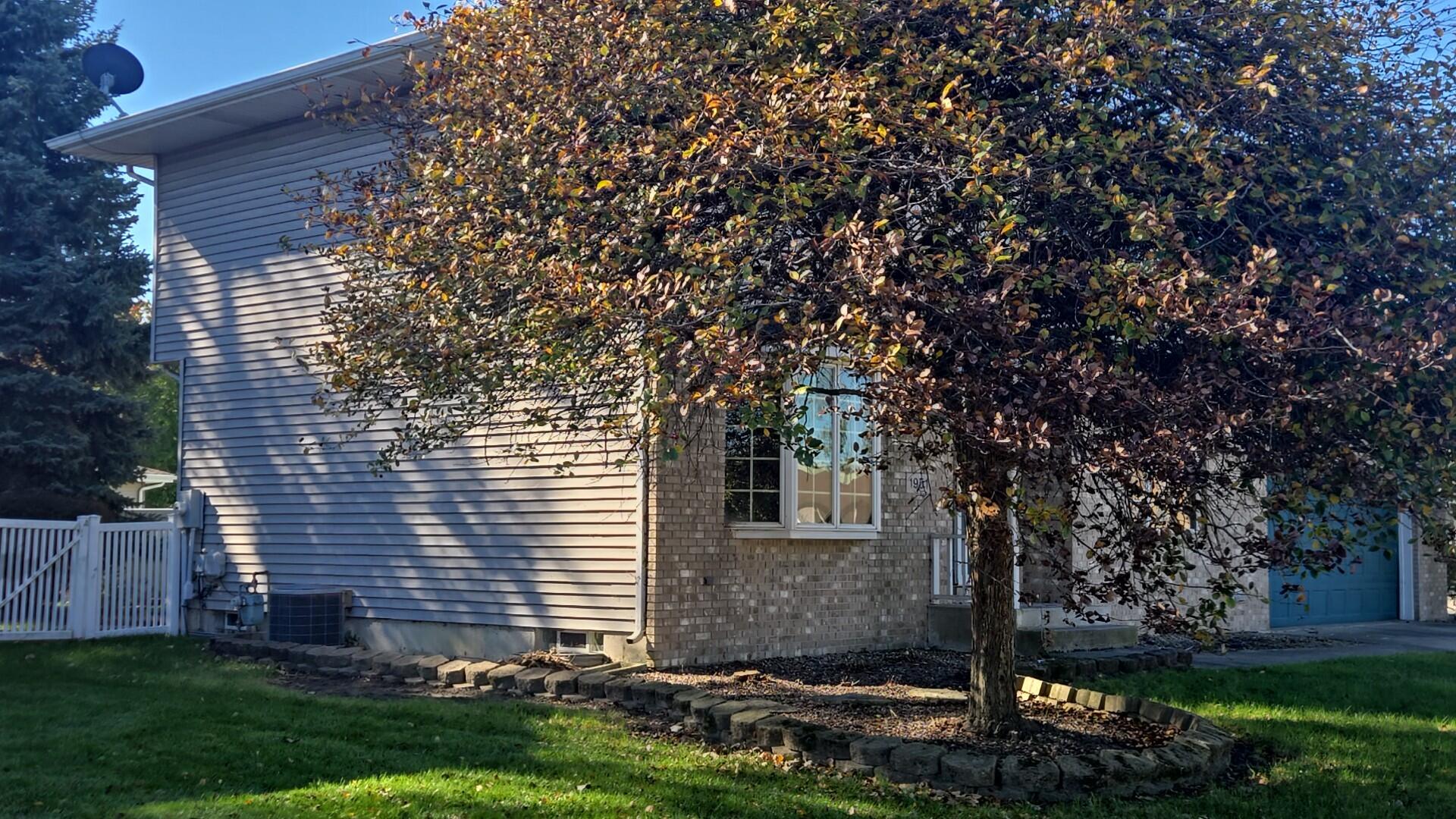 1951 West Ash Street Griffith, IN 46319 - Photo 3 of 23 a front view of a house with garden