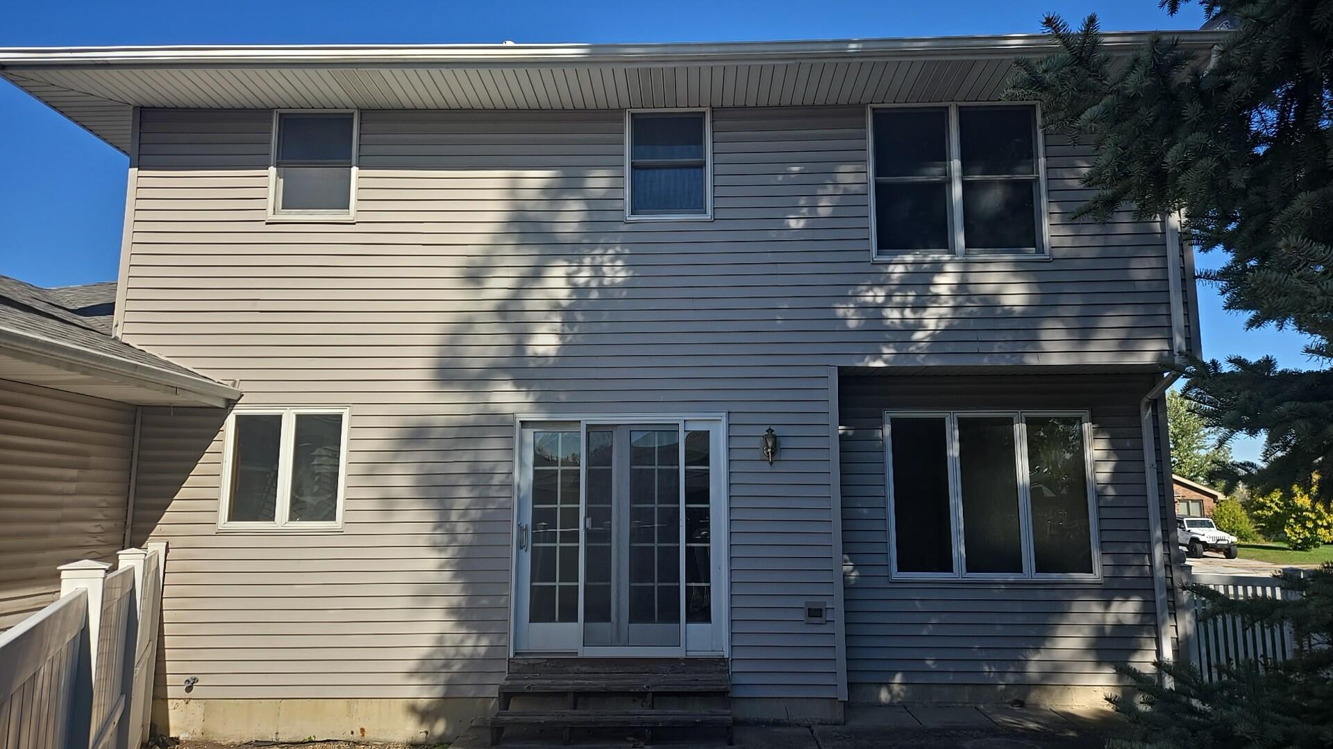 1951 West Ash Street Griffith, IN 46319 - Photo 4 of 23 a front view of a house with glass windows and garage