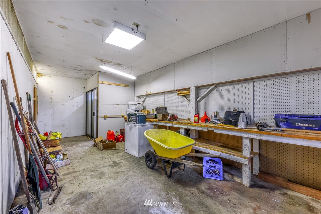 1844 Matz Road Ferndale, WA 98248 - Photo 34 of 39 a storage & utility room with sink dryer and bicycles
