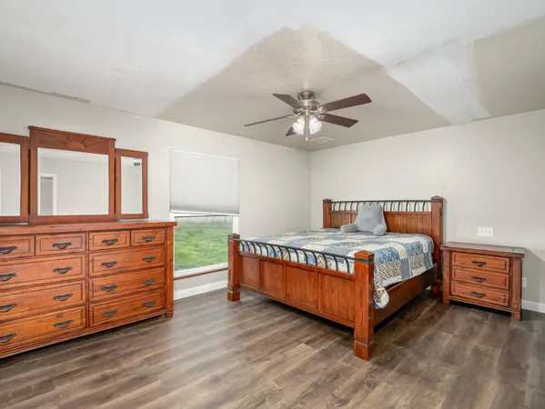 a bedroom with a bed and a dresser