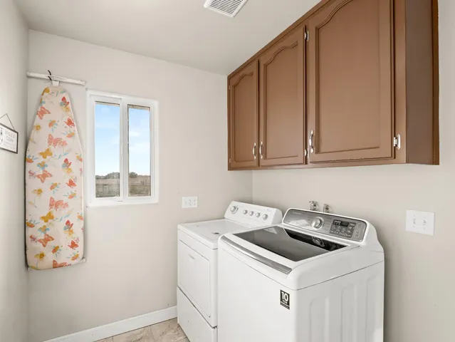 a view of utility room with washer and dryer