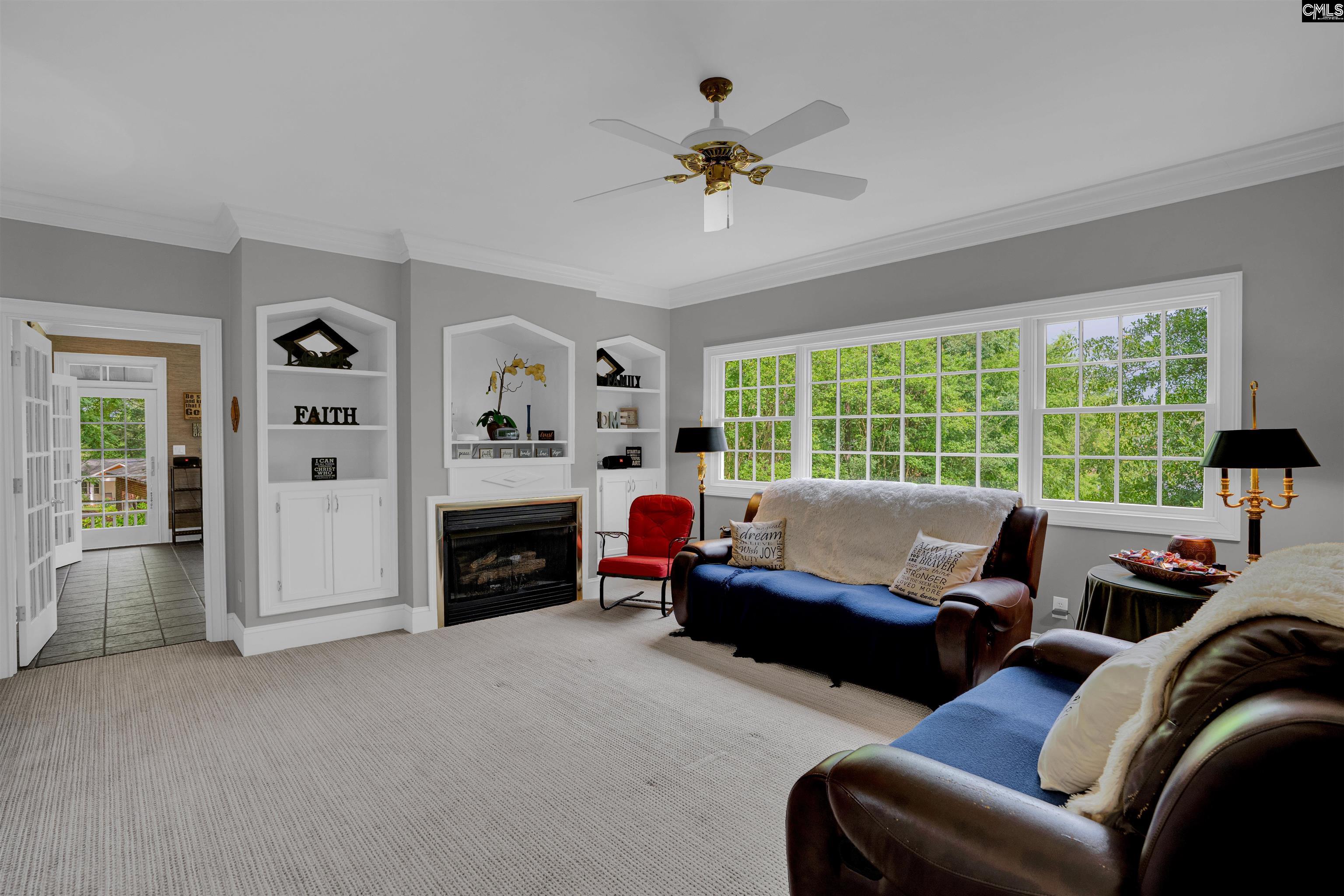 1101 Ellett Road Chapin, SC 29036 - Photo 9 of 24 a living room with furniture large window and a fireplace