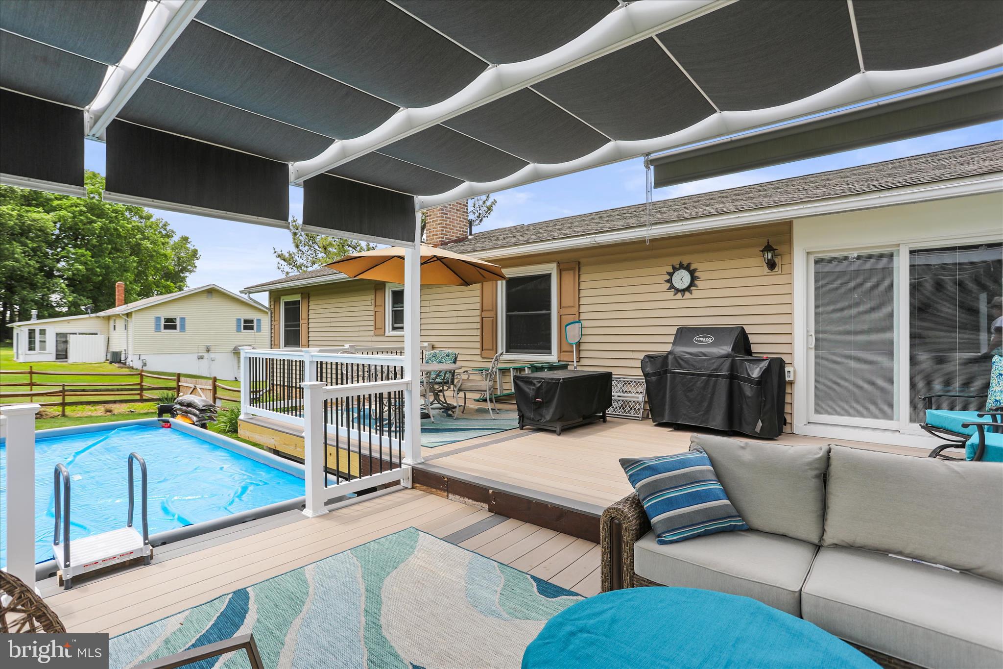 88 Sunset Drive Hanover, PA 17331 - Photo 37 of 51 a view of a patio with couches table and chairs with wooden floor