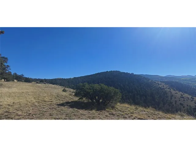 a view of mountain with sunset