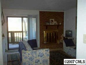11111 Harrowfield Road, Unit 8224 Charlotte, NC 28226 - Photo 2 of 8 a view of living room kitchen and entryway