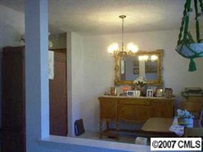 11111 Harrowfield Road, Unit 8224 Charlotte, NC 28226 - Photo 3 of 8 a bathroom with a sink and a mirror
