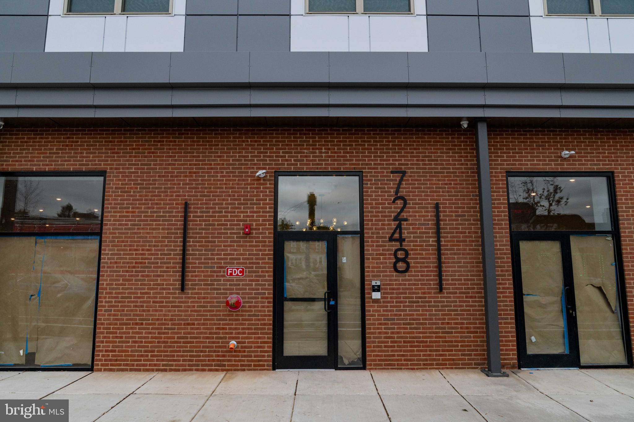 7248 Rising Sun Avenue Philadelphia, PA 19111 - Photo 3 of 25 a front view of a building with entryway