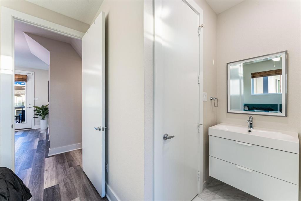 4013 Ivanhoe Lane Dallas, TX 75212 - Photo 26 of 38 Bathroom featuring vanity and wood-type flooring