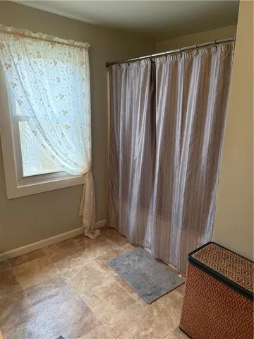 a room with furniture and wooden floor