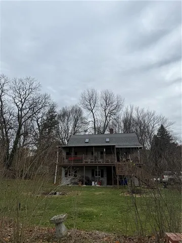 a view of a field with trees