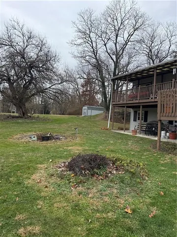a view of outdoor space with trees all around