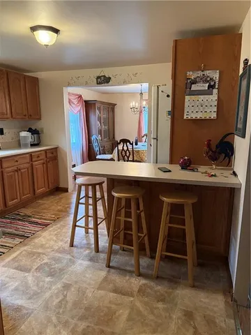 a kitchen with stainless steel appliances kitchen island granite countertop a sink and cabinets