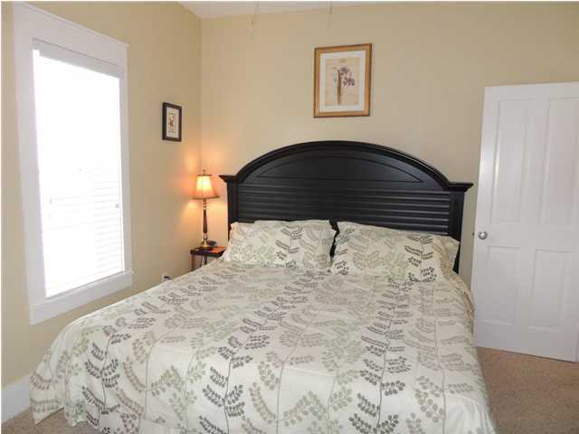 134 Somerset Bridge Road Santa Rosa Beach, FL 32459 - Photo 12 of 36 a bedroom with a bed and a dresser