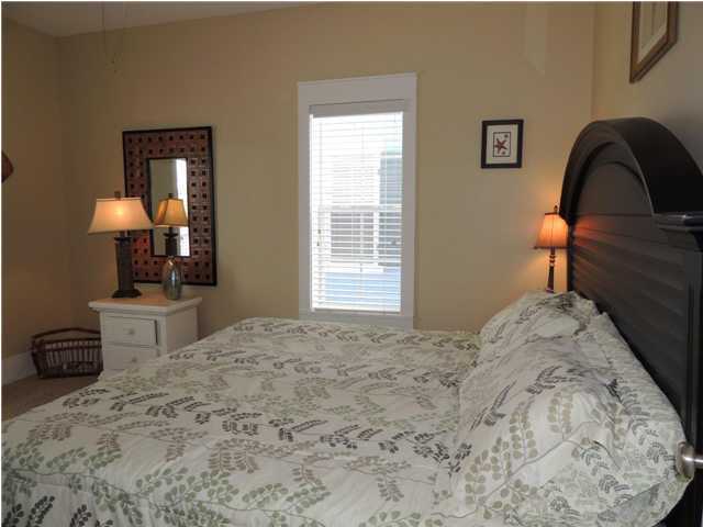 134 Somerset Bridge Road Santa Rosa Beach, FL 32459 - Photo 13 of 36 a bedroom with a bed and a mirror on dresser