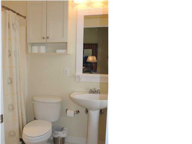 134 Somerset Bridge Road Santa Rosa Beach, FL 32459 - Photo 16 of 36 a bathroom with a sink a toilet and mirror