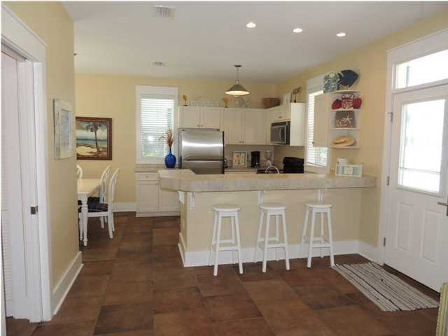 134 Somerset Bridge Road Santa Rosa Beach, FL 32459 - Photo 3 of 36 a kitchen with stainless steel appliances a refrigerator and microwave