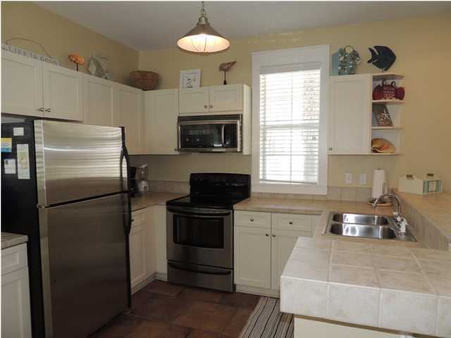 134 Somerset Bridge Road Santa Rosa Beach, FL 32459 - Photo 24 of 36 a kitchen with a refrigerator stove and sink
