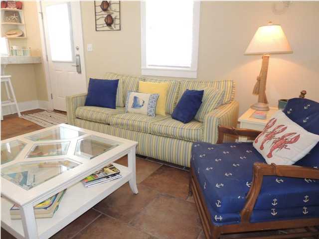 134 Somerset Bridge Road Santa Rosa Beach, FL 32459 - Photo 26 of 36 a living room with furniture and a lamp