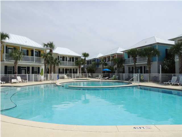 134 Somerset Bridge Road Santa Rosa Beach, FL 32459 - Photo 30 of 36 a view of a swimming pool with lawn chairs and floor to ceiling window
