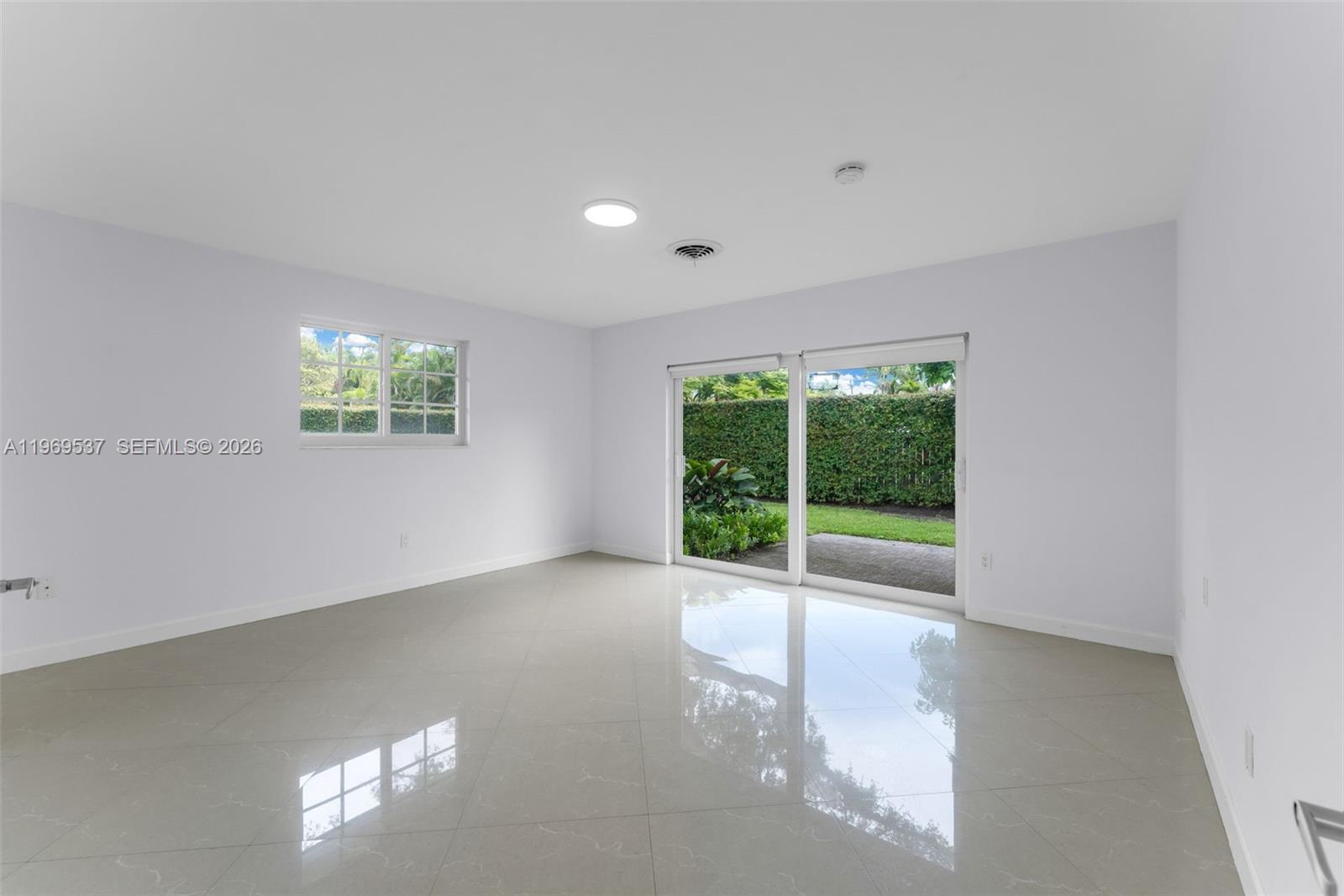 7451 Southwest 133rd Street Pinecrest, FL 33156 - Photo 25 of 36 Large bedroom with private patio