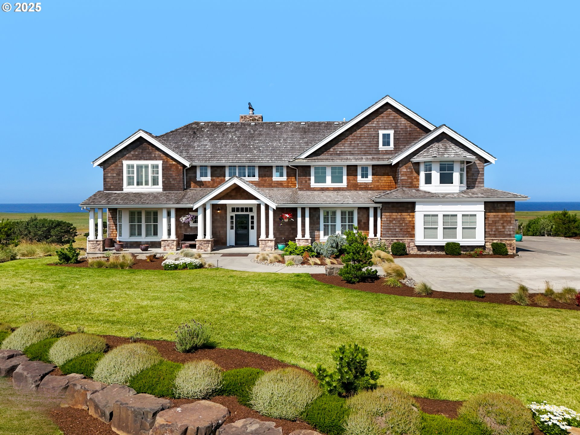 a front view of a house with swimming pool having outdoor seating