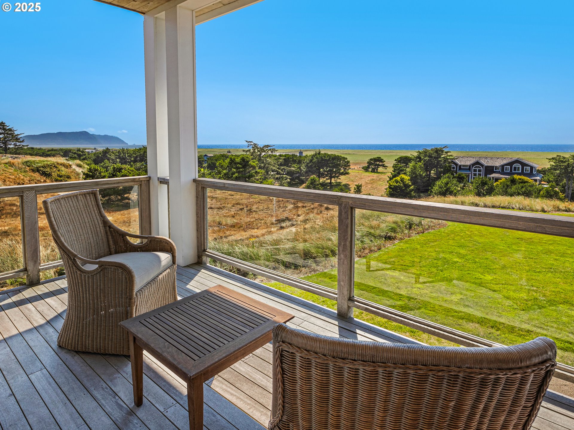 89062 Pinehurst Road Gearhart, OR 97138 - Photo 20 of 42 a view of a balcony with chair and wooden floor
