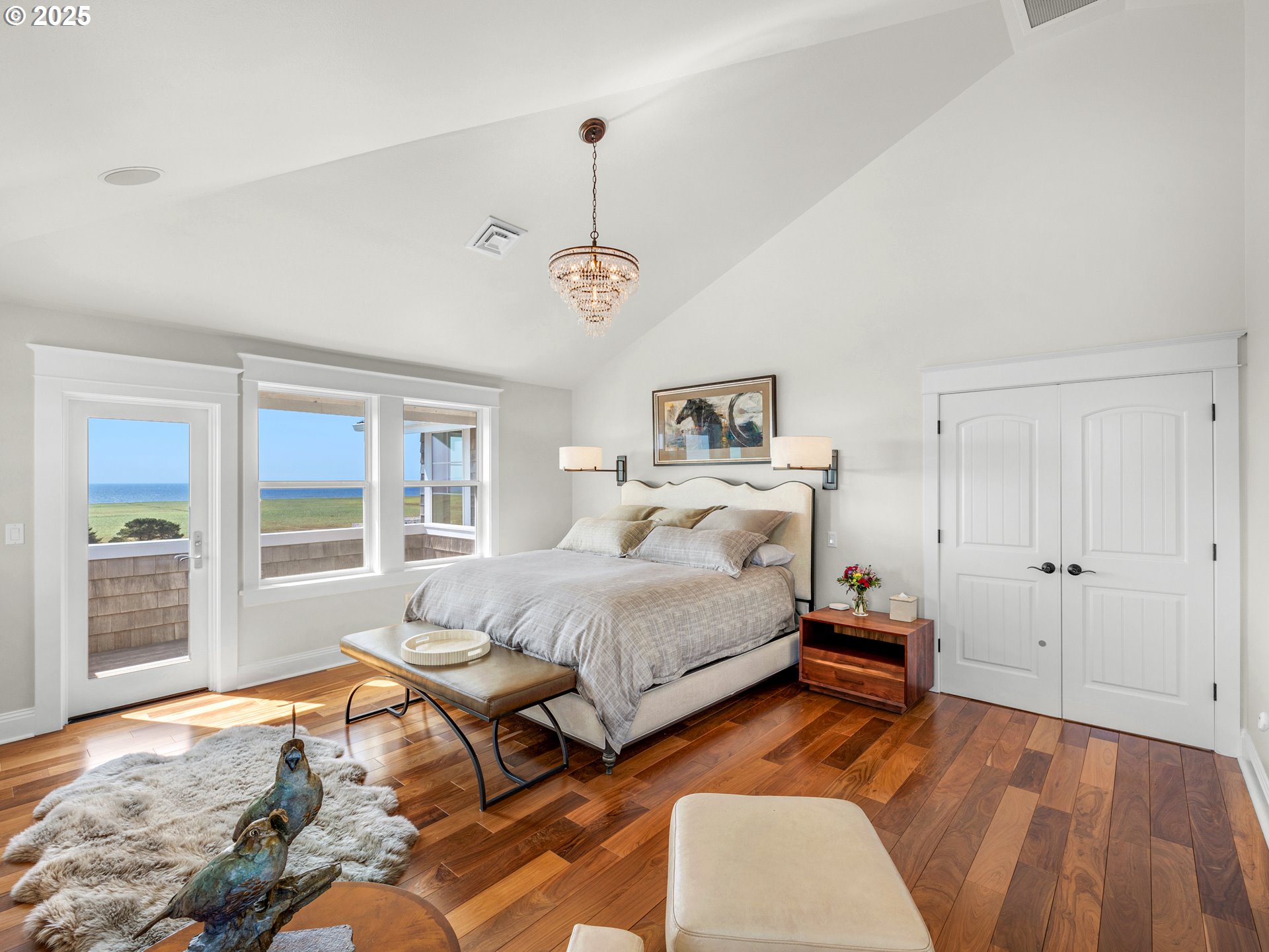 89062 Pinehurst Road Gearhart, OR 97138 - Photo 23 of 42 a spacious bedroom with a bed and a window